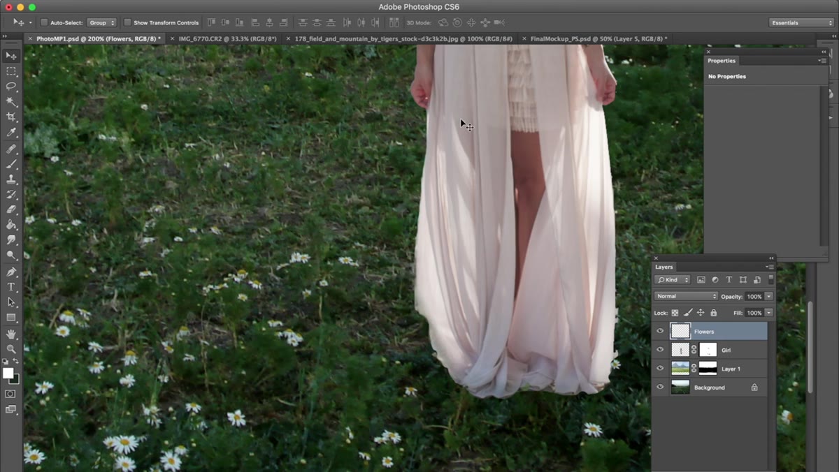 Flowers being composited around the model&rsquo;s dress area