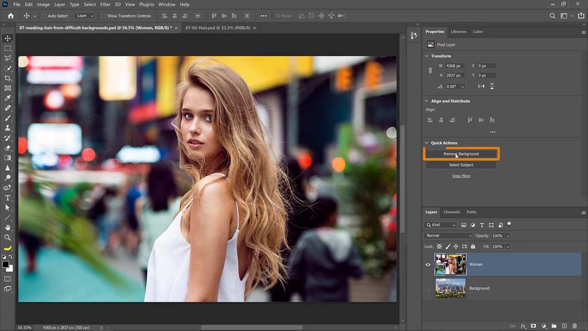Photoshop&rsquo;s Remove Background button applied to the woman layer