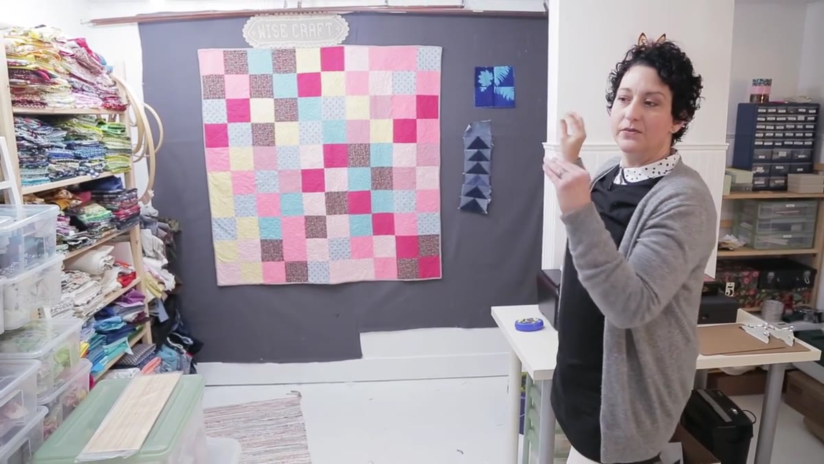 Flannel design wall with quilt pieces arranged for visual assessment